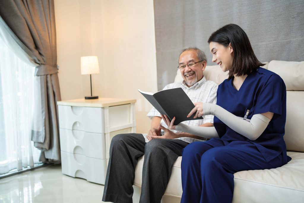 asian-young-woman-nurse-at-nursing-home-taking-car-U6ARS55.jpg